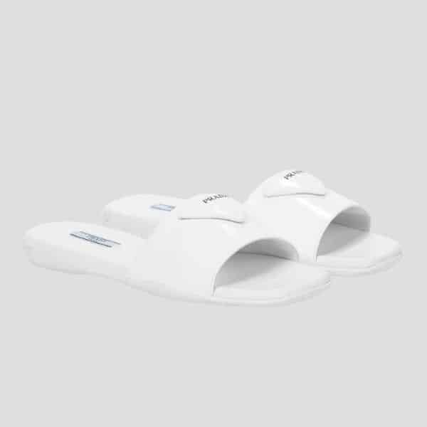xr:d:DAFPeDf88oI:2302,j:43125337113,t:22120502 Prada Brushed Leather Slide In White - Image 1
